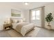 Bright bedroom with neutral tones, large window, and stylish decor at 9993 Birch Knoll Ave, Las Vegas, NV 89166