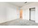 Carpeted bedroom with large closet, neutral color palette, and modern ceiling fan at 9993 Birch Knoll Ave, Las Vegas, NV 89166