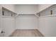 Walk-in closet includes rods for ample storage at 9993 Birch Knoll Ave, Las Vegas, NV 89166