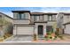 Lovely two-story home with a tile roof, attached garage, and manicured front yard at 9993 Birch Knoll Ave, Las Vegas, NV 89166