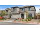 Charming two-story home features a tile roof, two-car garage, and landscaped front yard at 9993 Birch Knoll Ave, Las Vegas, NV 89166