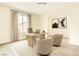 Bright home office features a large window, modern desk, and comfortable seating at 9993 Birch Knoll Ave, Las Vegas, NV 89166