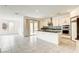 Modern kitchen with island, stainless appliances, and tile backsplash at 9993 Birch Knoll Ave, Las Vegas, NV 89166