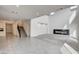 Bright open living room with modern fireplace, staircase and easy access to kitchen at 9993 Birch Knoll Ave, Las Vegas, NV 89166