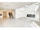Bright living room features tile floors, fireplace, and staircase at 9993 Birch Knoll Ave, Las Vegas, NV 89166