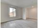 Spacious living room with light wood-look floors and a large window offering plenty of natural light at 9993 Birch Knoll Ave, Las Vegas, NV 89166