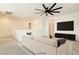 Loft living room area featuring a comfy sofa, TV, and a ceiling fan at 9993 Birch Knoll Ave, Las Vegas, NV 89166