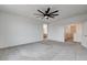 Open main bedroom featuring neutral carpet and a ceiling fan at 9993 Birch Knoll Ave, Las Vegas, NV 89166