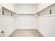 Spacious walk-in closet with ample shelving and carpeting for optimal storage solutions at 9993 Birch Knoll Ave, Las Vegas, NV 89166