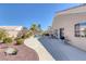 An attractive backyard offers a pool with a waterfall feature and a partially covered patio for entertaining at , Las Vegas, NV 89130