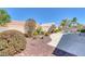Landscaped backyard features beautiful greenery and a peaceful rock waterfall feature near the pool at , Las Vegas, NV 89130