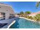 Beautiful backyard with a sparkling pool, inviting patio furniture, and well-maintained landscaping at , Las Vegas, NV 89130