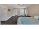 Second spacious bedroom with wood floors, neutral walls and ceiling fan at , Las Vegas, NV 89130