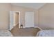 Bright bedroom with two twin beds, carpet, and a closet at , Las Vegas, NV 89130
