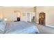 Cozy carpeted bedroom with attached bathroom and antique cabinet at , Las Vegas, NV 89130