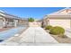 A long driveway leads to a two-car garage, offering ample parking and curb appeal at , Las Vegas, NV 89130
