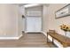 Bright entryway featuring stylish laminate floors, high ceilings, and a charming console table at , Las Vegas, NV 89130