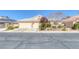 Charming single-story home boasts a well-manicured front yard and a convenient two-car garage at , Las Vegas, NV 89130