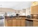 Spacious kitchen with wood cabinets, laminate flooring and stainless steel appliances, perfect for entertaining at , Las Vegas, NV 89130