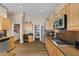 Well-equipped kitchen features wooden cabinets, stainless steel appliances, and modern laminate flooring at , Las Vegas, NV 89130