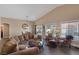 Spacious living room with dining area, comfortable seating, and natural light from large windows at , Las Vegas, NV 89130