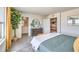 Spacious bedroom offers ample natural light, neutral decor, and access to an ensuite bathroom and additional living area at , North Las Vegas, NV 89084