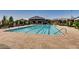 Resort-style community pool with ample lounge seating and mountain views at 10271 Bark Pine Ct, Las Vegas, NV 89166