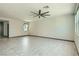 Bright and airy living room with large windows and stylish ceiling fan at 10271 Bark Pine Ct, Las Vegas, NV 89166