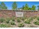 Pinyon Chase community signage with stone wall, landscaping, and decorative rock features at 10271 Bark Pine Ct, Las Vegas, NV 89166