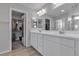 Elegant bathroom boasting double sinks, ample counter space, and access to walk-in closet at 10367 Andele Ave, Las Vegas, NV 89166
