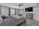 Well-lit bedroom with a cozy beanbag chair and sleek storage, providing comfort and functionality at 10367 Andele Ave, Las Vegas, NV 89166