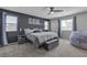 Spacious primary bedroom with a ceiling fan, stylish decor and plenty of natural light at 10367 Andele Ave, Las Vegas, NV 89166