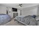Bright bedroom featuring large TV and cozy seating creating a relaxed atmosphere at 10367 Andele Ave, Las Vegas, NV 89166