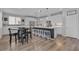 Bright, modern kitchen with a large island, stainless steel appliances, and breakfast bar seating at 10367 Andele Ave, Las Vegas, NV 89166