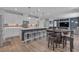 Spacious kitchen with modern appliances, a large island with seating, and an open layout to the living room at 10367 Andele Ave, Las Vegas, NV 89166
