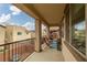 Relaxing covered balcony with a seating area, outdoor decor, and neighborhood views at 10766 La Florentina Ave, Las Vegas, NV 89166