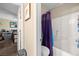 Bathroom featuring a shower and toilet and a hallway view at 10766 La Florentina Ave, Las Vegas, NV 89166