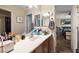 Bathroom featuring a sink vanity with an extended counter and a large mirror at 10766 La Florentina Ave, Las Vegas, NV 89166