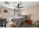 Bedroom featuring carpet, a ceiling fan, and sliding door to a private balcony at 10766 La Florentina Ave, Las Vegas, NV 89166