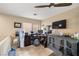 Bonus room featuring ceiling fan, a large window and carpeted flooring at 10766 La Florentina Ave, Las Vegas, NV 89166