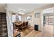 Cozy dining area with modern light fixture and staircase nearby at 10766 La Florentina Ave, Las Vegas, NV 89166