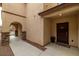 Attractive front door with a small porch area and rock landscaping at 10766 La Florentina Ave, Las Vegas, NV 89166