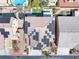 Aerial view showcases solar panels, backyard pool, lush landscaping, and covered patios at 1112 Adobe Creek Ct, North Las Vegas, NV 89084