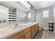Bathroom featuring double sinks, a soaking tub, and a shower with a curtain at 1112 Adobe Creek Ct, North Las Vegas, NV 89084