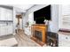 Cozy living room featuring a decorative fireplace with a wooden mantel, neutral decor, and updated flooring at 1112 Adobe Creek Ct, North Las Vegas, NV 89084