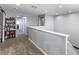 Open loft area features neutral carpeting and paint, with views to other rooms at 1112 Adobe Creek Ct, North Las Vegas, NV 89084