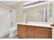 Bathroom with tile surround, vanity, and mirror at 1307 Summer Dawn Ave, Henderson, NV 89014