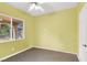 Well-lit bedroom with neutral carpet, a window providing natural light, and ample space for relaxation at 1307 Summer Dawn Ave, Henderson, NV 89014
