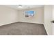 A spacious bedroom features neutral walls, plush carpeting, and natural light at 1307 Summer Dawn Ave, Henderson, NV 89014
