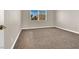A spacious bedroom features neutral walls, plush carpeting, and natural light at 1307 Summer Dawn Ave, Henderson, NV 89014